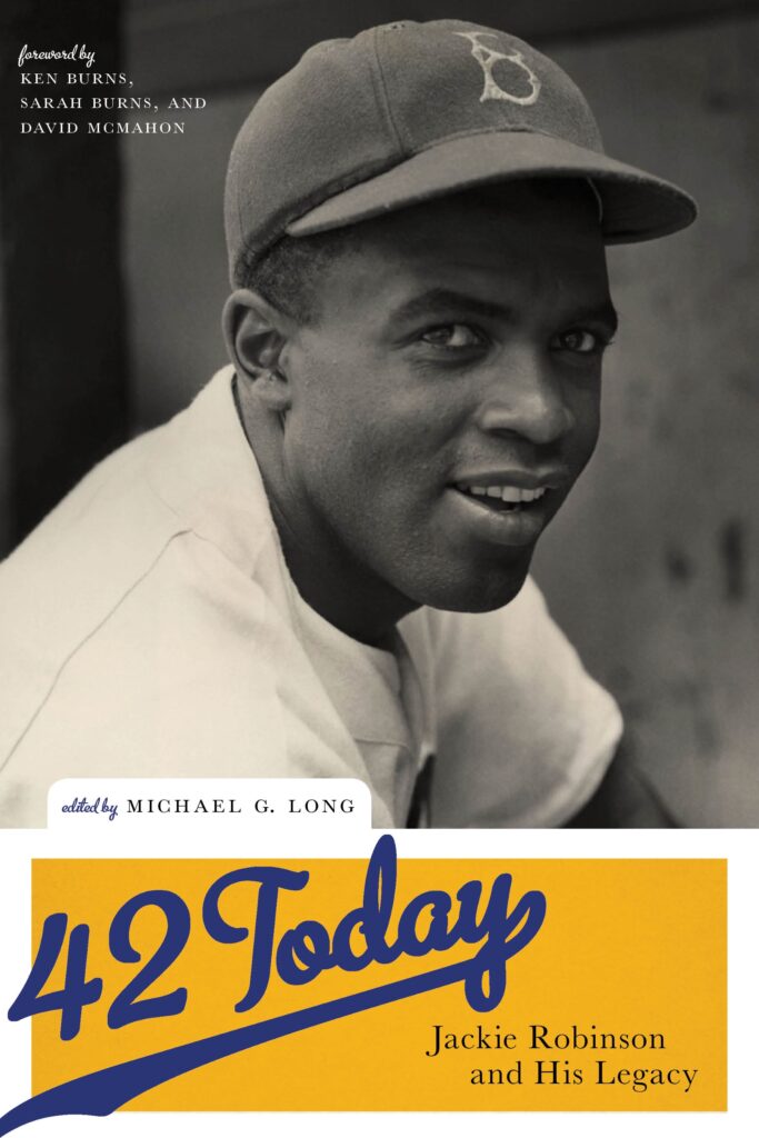 On the cover of 42 Today, there is a black and white photo of Jackie Robinson smiling at the camera.